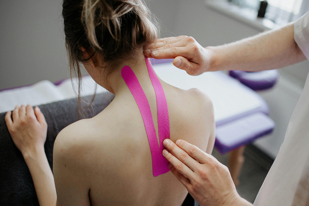 Kinesiotape chiropractor application for neck pain